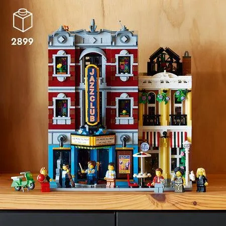 A detailed build of the LEGO Jazz Club 10312, showing the stage, pizzeria, and minifigures.